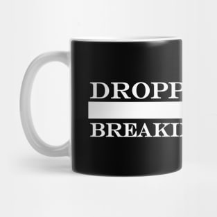 dropping jaws breaking hearts Mug